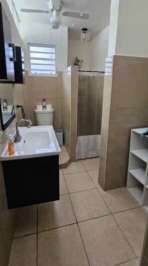 Shower, towels, toilet paper