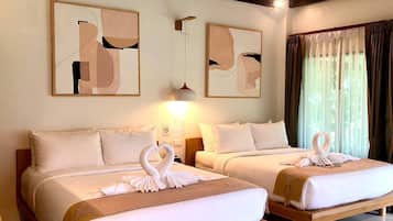 Deluxe Quadruple Room, Beach View | 3 bedrooms, desk, laptop workspace, free WiFi