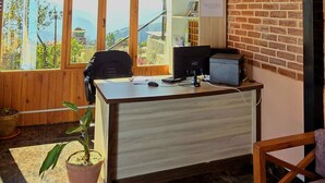 A wooden interior with a desk, computer, and chair. - Hotel Dolkha Durbar (Bhimeshwar)