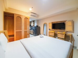 Deluxe Studio (queenbed) | Free WiFi, bed sheets - Comfortable Studio at Patraland Amarta Apartment (Ngaglik)
