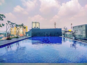 Outdoor pool - Comfy and Minimalist Studio Apartment at Evenciio Margonda (Depok)