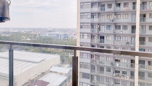 A high-rise building with multiple balconies, large windows, and a view of the cityscape. - Good Deal and Cozy Studio Daan Mogot City Apartment (Jakarta)