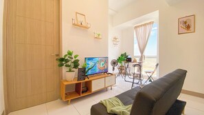 Deluxe Apartment (twin) | Living area - Fancy and Homey 2BR at Tokyo Riverside PIK 2 Apartment (Teluknaga)