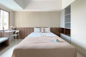 Deluxe Studio (queenbed) | Bed sheets - Cozy and Warm Studio at LRT City Jatibening Apartment (Bekasi)