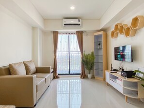 Deluxe Apartment (twin) | Living area - Convenient and Tidy 2BR at Meikarta Apartment (Cikarang)