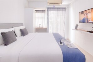 Deluxe Studio (queenbed) | Bed sheets - Restful and Tidy Studio at Serpong Garden Apartment (Cisauk)