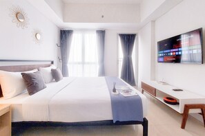 Minibar, bed sheets - Modern and Elegant Studio at Apartment Tamansari Bintaro Mansion (South Tangerang)