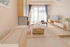 Appartement Deluxe (queenbed) | Aire de séjour