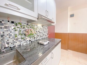 Deluxe Apartment (twin) | Private kitchen - The Cozy Abode 2BR Apartment at Tamansari Panoramic (Bandung)