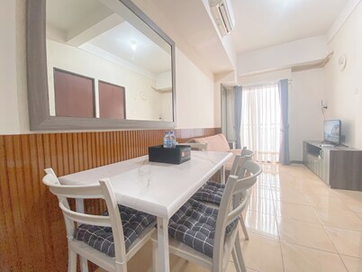 The Cozy Abode 2BR Apartment at Tamansari Panoramic
