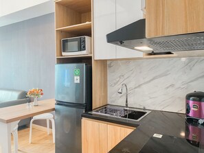 Private kitchen - Spacious and Restful 1BR at Vasanta Innopark Apartment (Cikarang)