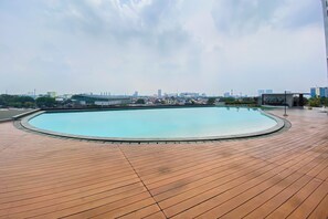 Outdoor pool - Chic and Cozy Studio at Patraland Urbano Apartment (Bekasi)
