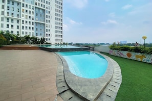 Outdoor pool - Chic and Cozy Studio at Patraland Urbano Apartment (Bekasi)