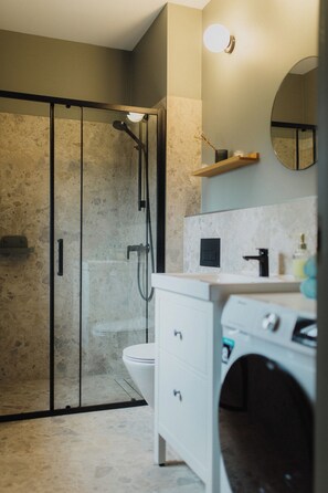 Shower, towels, soap, toilet paper