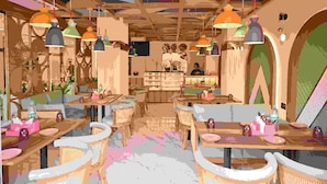 Un ristorante con diversi tavoli e sedie, lampadari pendenti e una zona bar.