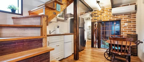 Design Townhome, Garden View | Living area | 55-inch flat-screen TV with digital channels