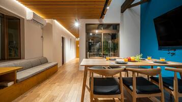 Apartment, Balcony | Living area | 85-inch flat-screen TV with digital channels, TV, video-game console