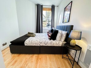 1 bedroom, desk, iron/ironing board, travel cot