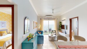 Premium Studio | Living area | 56-inch Smart TV with digital channels, books, streaming services - Priya Living Flower Valley (Sohna)