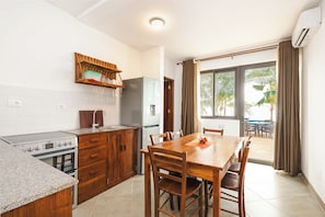 Family Quadruple Room (Family Room Sea View) | Private kitchen - Blackstone Beach Resort  (Uroa)
