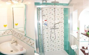 Shower, hair dryer, towels, toilet paper