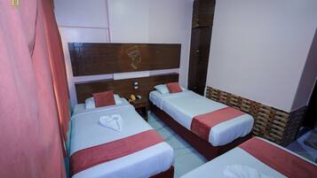 Triple Room, City View | 1 bedroom, in-room safe, blackout drapes, soundproofing