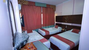 Triple Room, City View | 1 bedroom, in-room safe, blackout drapes, soundproofing