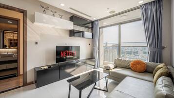 Comfort Apartment, 2 Bedrooms, City View | Living area | 55-inch LCD TV with digital channels