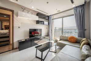 Comfort Apartment, 2 Bedrooms, City View | Living area | 55-inch LCD TV with digital channels