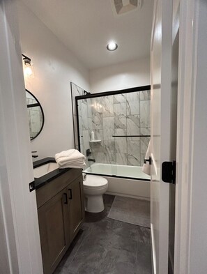 Hair dryer, towels, soap, toilet paper