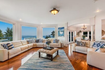 Custom estate with 6 bedrooms, 4+baths, private beach in enchanting Coupeville.