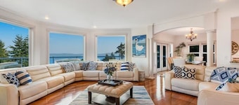 Custom estate with 6 bedrooms, 4+baths, private beach in enchanting Coupeville.