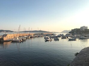 Enjoy scenic views of the marina and surrounding hills, perfect for boating and taking in the local atmosphere.