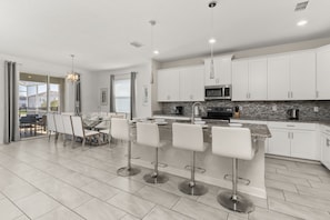 Fridge, microwave, oven, stovetop - Luxury 6BR Escape – Pool, Water Slides & Lazy River Near Disney! (Four Corners)