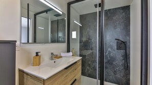 Shower, hair dryer, towels, toilet paper