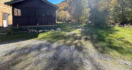 Classic original cedar log cabins set on Simms Stream in the North East Kingdom.