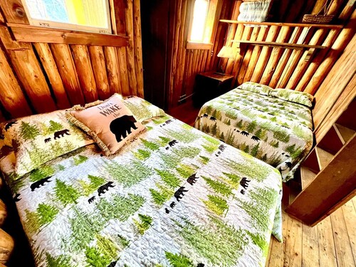 Classic original cedar log cabins set on Simms Stream in the North East Kingdom.