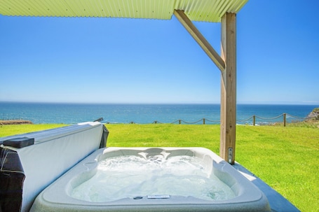 Outdoor spa tub. Dolphin by OceanviewHotTubs Tesla charging Oceanfront Shelter Cove