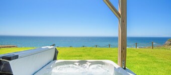 Dolphin by OceanviewHotTubs Tesla charging Oceanfront Shelter Cove
