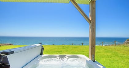 Dolphin by OceanviewHotTubs Tesla charging Oceanfront Shelter Cove