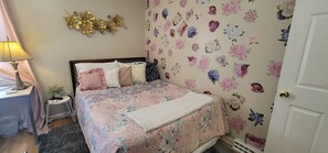 1 bedroom, desk, iron/ironing board, travel crib