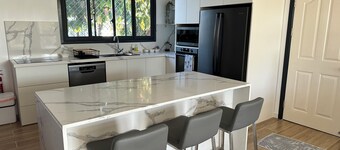 New 4-bedroom home in prime location in Taumeasina with AC in all rooms. 