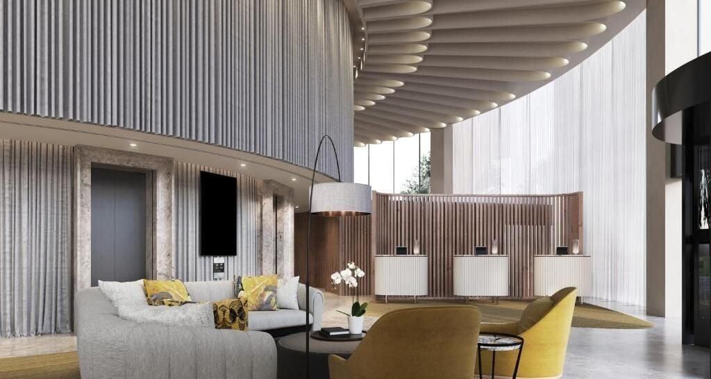 A modern interior with a sofa, chairs, and a dining area.