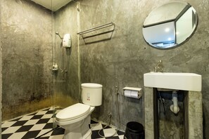 A bathroom with a toilet, a shower, and a sink. - The Secret Service Hotel (Bangkok)