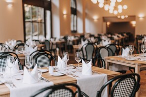 A restaurant with multiple tables set for dining, featuring white tablecloths and neatly arranged cutlery. - Miramare (Crikvenica)