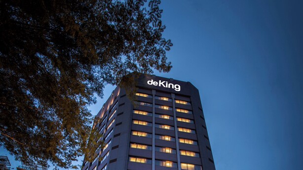 A tall hotel with a prominent 'deKing' sign, featuring a modern facade and illuminated windows. - de King Hotel Klcc (Kuala Lumpur)
