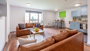 A modern apartment with a living room, kitchen, and dining area. - For Students Only Bryson Court (Newcastle-upon-Tyne)