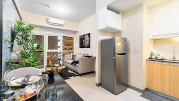 Deluxe Apartment | Living area | Smart TV
