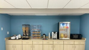 A kitchenette with a coffee machine, a refrigerator, and a microwave. - Days Inn by Wyndham Farmington NM (Farmington)