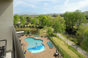 Outdoor pool, open 8:00 AM to 10:00 PM, pool umbrellas, pool loungers